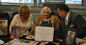 Assembly Majority Leader Joe Morelle visits with Mary Vill and her family