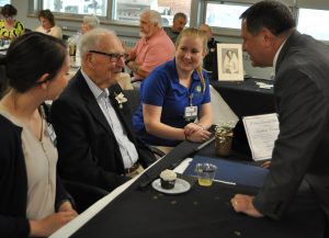 Assembly Majority Leader Joe Morelle visits with Matthew Cornelia and Chapel Oaks employees Mackenzie and Morgan